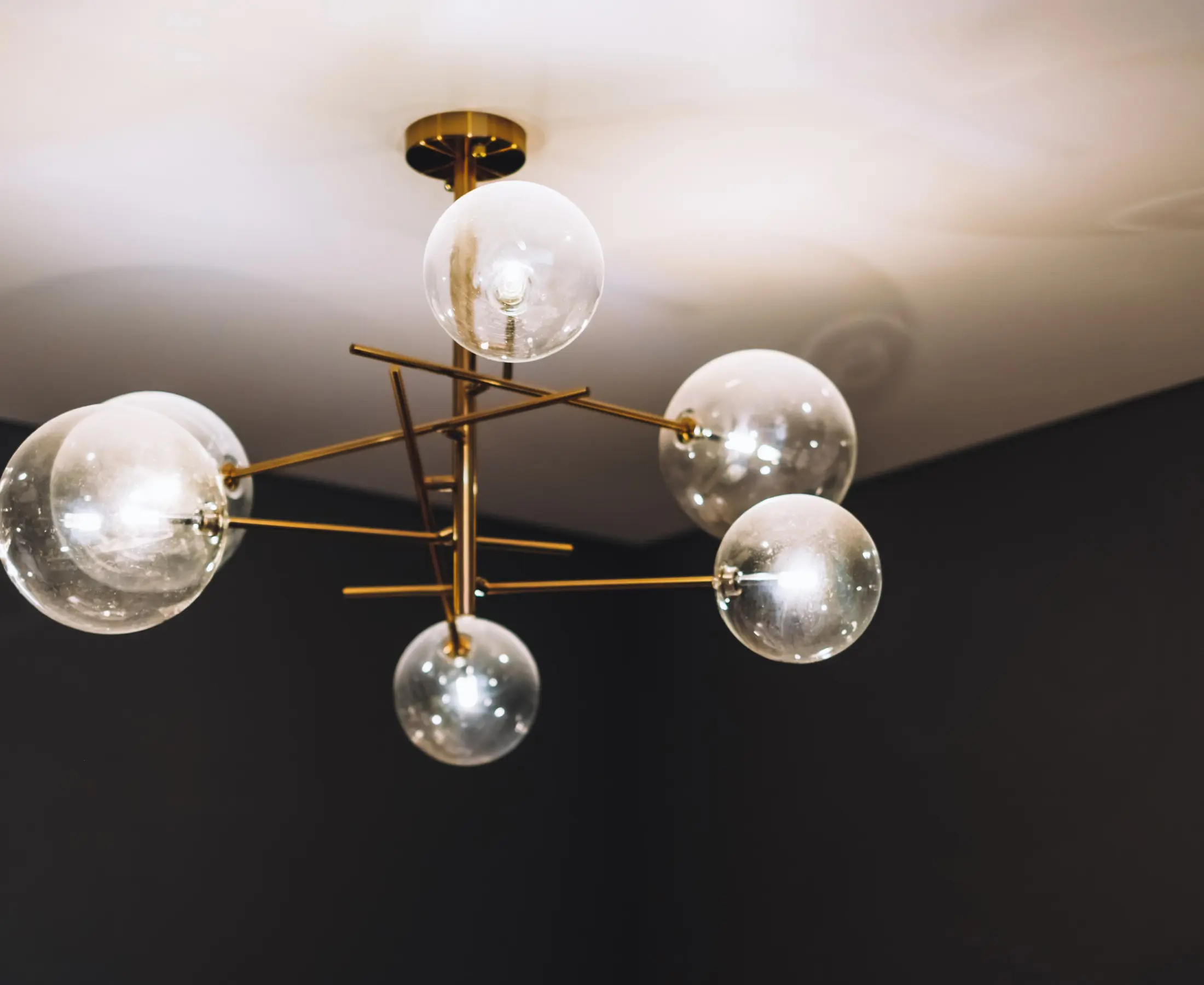 Modern chandelier with spherical glass bulbs.